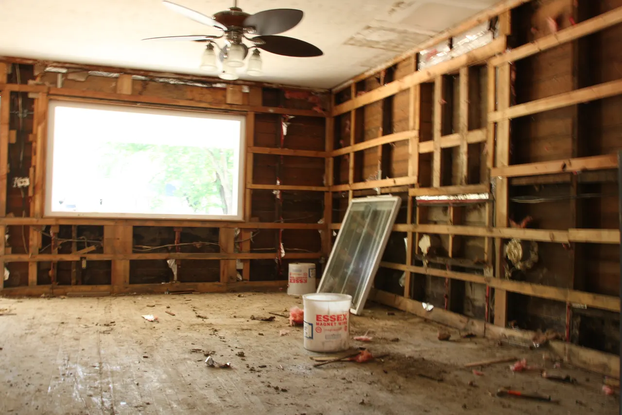 Removed flood-damaged wall finishes exposing interior framing